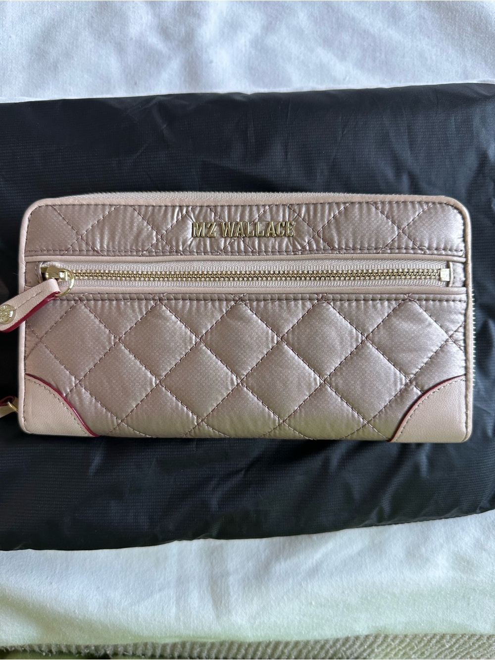 NWOT MZ Wallace
Crosby wallet in rose gold metallic.